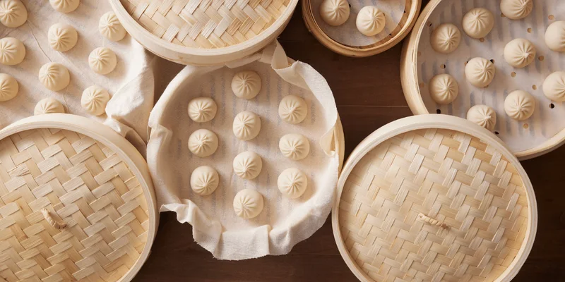 Bamboo steaming baskets stacked on a table